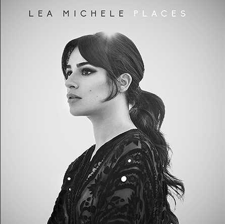 Image of Lea Michele from the shoulders up, facing sideways with her eyes closed with a slight breeze